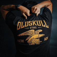 Load image into Gallery viewer, This shirt is similar to the Harley Davidson style of shirts.  It is black with orange print.  It has a small Oldskull Shirts logo on the front.  On the back it has an large eagle over a shield design with the words Oldskull Store written over it.  It is a vintage streetwear design.