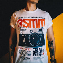 Load image into Gallery viewer, The Photographer Camera Shirt shows where it all started. Your not just someone using an camera phone for selfies. You have the eye, the vision for the perfect shot. You move in and push the subject out of dead center. You shoot on manual. You shoot in RAW. You&#39;re a true photographer. Experience the OldSkull Shirts quality. -OldSkull Store USA the best shirt store in North America.